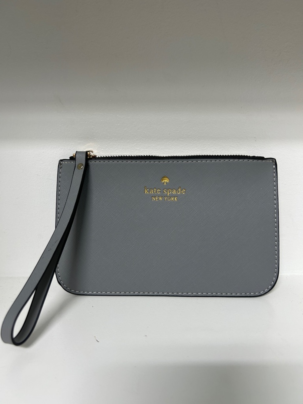 kate spade gray leather wristlet with gold logo